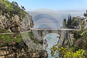 The view out to sea past the arched bridge at Fiordo di Furore on the Amalfi Coast, Italy