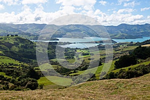 View over Akaroa from the green hills of Banks Peninsula