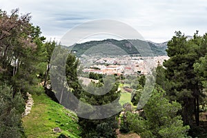 View over Andratx from above: village and green surroundings