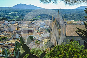 View over beautiful mediterranean village of Arta - Parish Church of the Transfiguration of the Lord on the right - Mallorca, photo