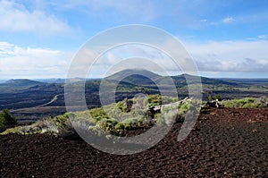 View over a black volcanic lava landscape from the Inferno Cone