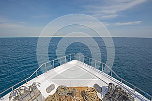 View over the bow over a large luxury motor yacht