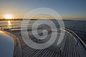 View over the bow over a large luxury motor yacht