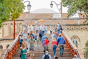 View over busy with tourists crowds in Venice, piers, promenade embankment at Accademia bridge and Grand Canal in Venetian