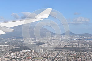 View over Cape Town by plane with the big Table Mountain, Signal Hill and Lions Head, South Africa