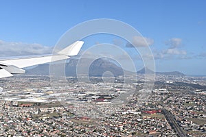 View over Cape Town by plane with the big Table Mountain, Signal Hill and Lions Head, South Africa