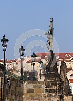 View over in Charles bridge,Statuary of St. Cross , Calvary . Prague.Czech Republic.