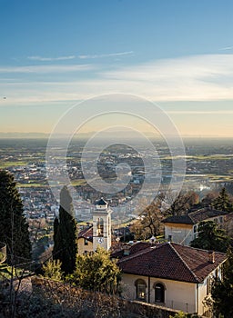 View over Citta Alta or Old Town buildings in the ancient city of Bergamo, Lombardia, Italy on a clear day, taken from