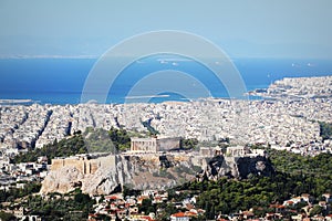 View over the city and the Acropolis from Lycabettus hill in Athens, Greece. Panorama of Athens . Beautiful cityscape with seashor