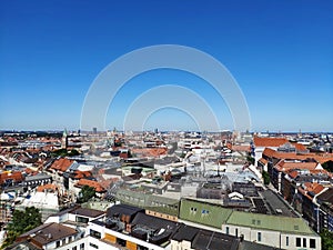 View over the city of Munich from the tower of Saint Peter. Scenic summer aerial panorama of the Old Town architecture