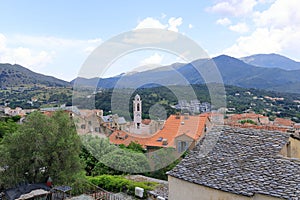 View over Corte city in Corsica surrounded by mountains, France