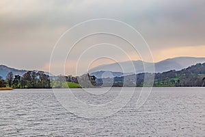 A view over Esthwaite Water in Cumbria, with evening light