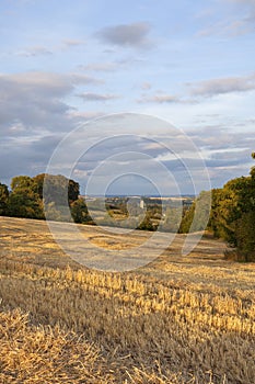 View over farmland towards the church at Chipping Campden, Cotswolds, Gloucestershire, England