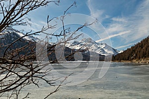View over the frozen lake of Silvaplana and the peak of the mount Corvatsch in the background