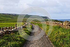 Small pedestrian path at Cliffs of Moher from Doolin, Ireland photo