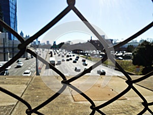 View over the I-85 highway through the wire fence