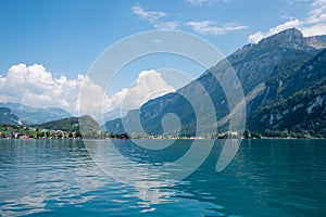 view over lake Brienzersee to lake shore and mountains, Bernese Oberland photo