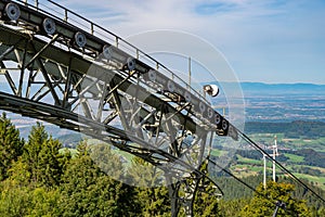 View Over a large deflection pulley of the Schauinsland cable car over Freiburg and the Rhine Valley to the Vosges Mountains