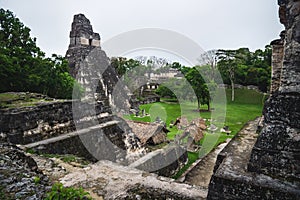 View over the main plaza to the `Temple of the great jaguar` in the Maya ruins of Tikal, Peten, Guatemala