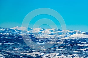 View over a majestic wilderness landscape in winter with clear blue skies