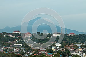 View over Medan city with volcano in the background, Sulawesi, Indonesia