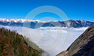 View over the mountain landscape and over the clouds