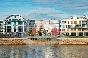 View over new modern houses at historical downtown in Magdeburg at Elbe river bank, Germany, at blue sky and Autumn golden colors