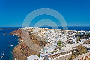 View over Oia and the coastline with traditional white houses, Santorini island, Greece