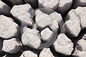 View over parched and empty dam, with cracked mud