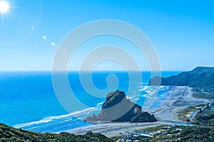 View over Piha beach, mighty Lion Rock in the centre, on the West coast of Auckland, New Zealand