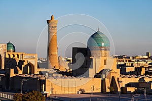 View over the Poi Kalon Mosque and Minaret from Ark fortress, in Bukhara, Uzbekistan. Blue sky