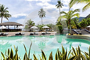 View over the pool to the tropical beach