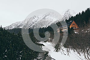 View over Popradske Pleso and snowcapped High Tatra mountains in winter