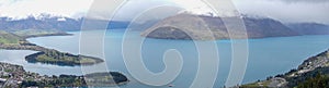 View over Queenstown Bay and Cecil Peak under cloudy skies in the South Island of New Zealand