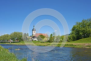 View over the river Murg on the parish church Saint Laurentius