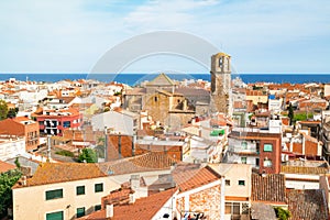 View over the roofs of old town Malgrat de Mar Spain from the hill with Mediterranean sea in the background photo