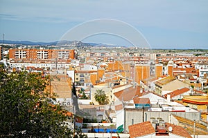 View over the roofs of the town Malgrat de Mar from the hill of the Parc del Castell photo