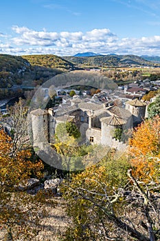 View over the roofs of the village of VogÃÂ¼ÃÂ©. Vertical photography taken in France photo