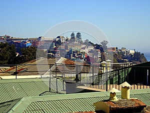 view over the rooftop to the colorful houses of Valparaiso, touristy city photo