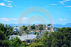 View over suburbian area of Wellington with mountains in the distance on a bright sunny day. photo