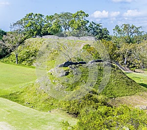 A view over temple mounds in the first plaza in the ancient Mayan city ruins of Altun Ha in Belize