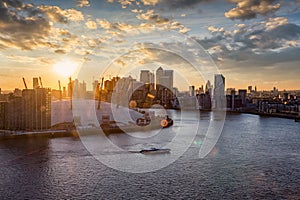 View over the Thames to the skyline of London during sunset time