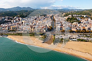 View over the town, beach and the fishing harbor of Arenys de Mar. on the mediterranean coast near Barcelona photo