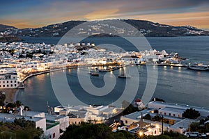 View over the town and old harbour of Mykonos during sunset