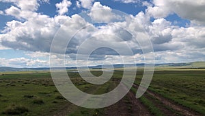 View over vivid vast field plateau on a sunny summer day