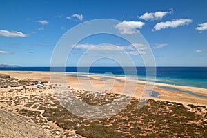 View over a wide beautiful bathing bay on the Canary Island Fuerteventura in the Atlantic Ocean