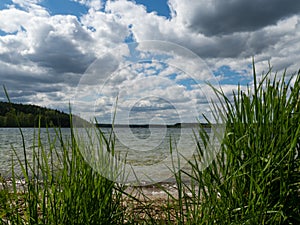 View over Wielewskie lake, sunny day. Blue sky with some white clouds.