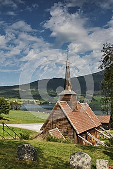 View over worn out tombstones at the RÃ¸dven Stave Church