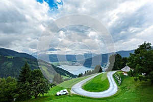 View over Zeller See lake. Zell Am See, Austria, Europe. Serpentine mountain road