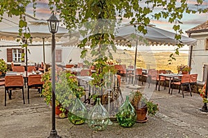 View from an overgrown and decorated terrace in Motovun over the surrounding countryside during the day